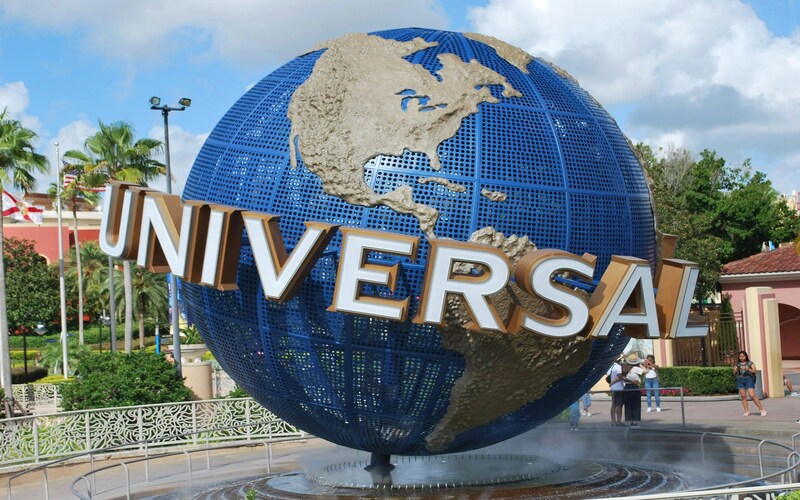 Entrance to Universal Studios Singapore with iconic globe and theme park rides